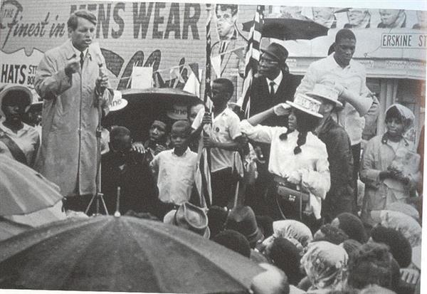 Robert F Kennedy speaks to a mostly black crowd outdoors